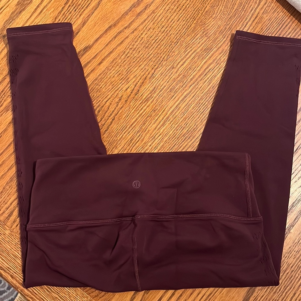 Lululemon burgundy leggings size 8, just under 25”.